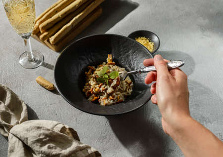 chanterelle risotto in a black plate. high quality photoの写真素材