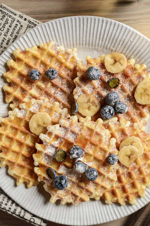 blueberry waffles on a wooden background. high quality photoの写真素材
