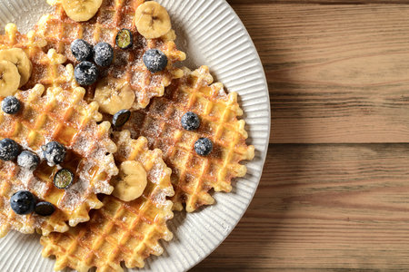 blueberry waffles on a wooden background. high quality photoの写真素材