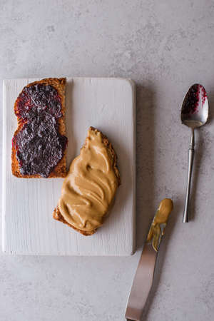 bread with berry jam and peanut butterの写真素材