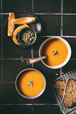 pumpkin soup on a black background. high quality photoの写真素材