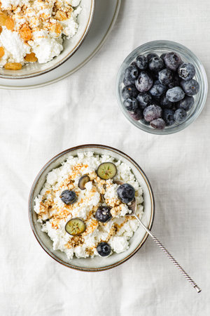 cottage cheese with blueberries and raisins. high quality photoの写真素材