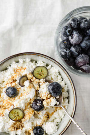 cottage cheese with blueberries on table. high quality photoの写真素材