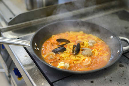 pasta with seafood in the restaurantの写真素材