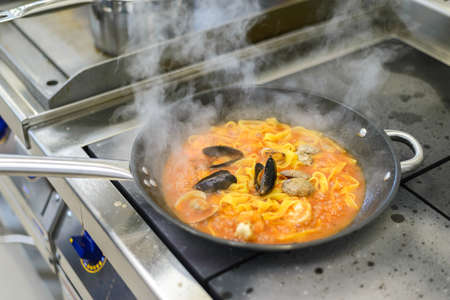 pasta with seafood in the restaurantの写真素材