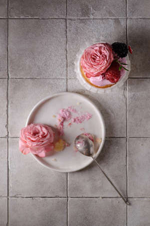 cupcakes with pink buttercream and roseの写真素材