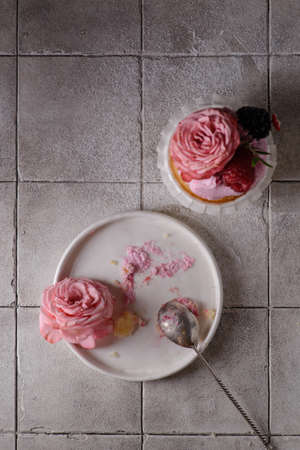 cupcakes with pink buttercream and roseの写真素材