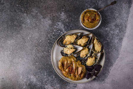 mussels baked in casings with cheeseの写真素材