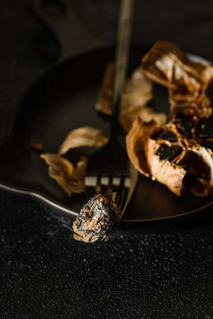 fermented black garlic on the background. high quality photoの写真素材