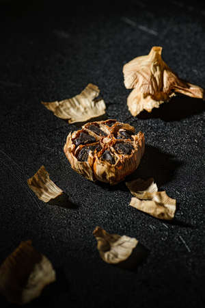 fermented black garlic on the background. high quality photoの写真素材
