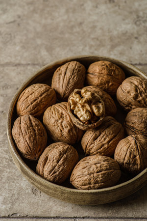walnuts in a shell in a bowlの写真素材