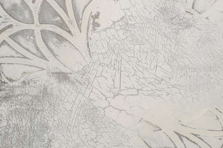 photo the background is light under cracked plaster with a patternの写真素材