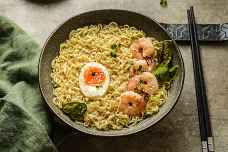 noodles with shrimp and egg. High quality photo Japanese chopsticks are lying nearbyの写真素材