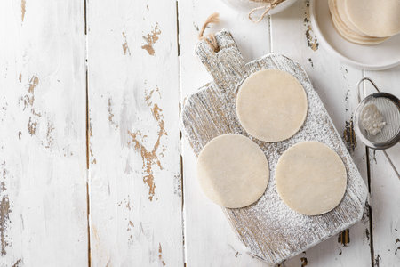 dough for dumplings circles on the board