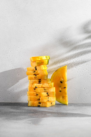 pieces of yellow watermelon in a stack. high quality photoの写真素材