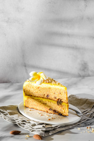 a piece of carrot cake on a light background. high quality photo