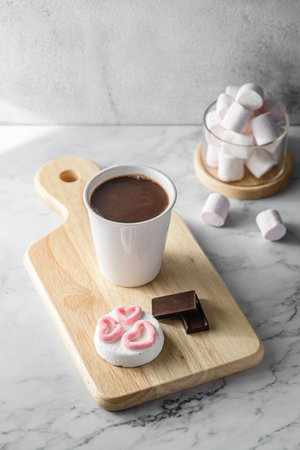 hot chocolate with marshmallow hearts on gray background, for Valentine's Day on February 14. High...