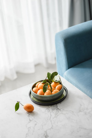 mango plum in a bowl on the table. high quality photoの写真素材