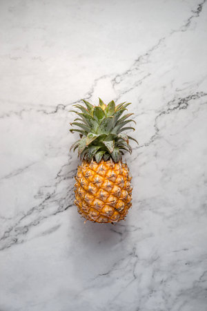 pineapple on a light marble background. high quality photoの写真素材