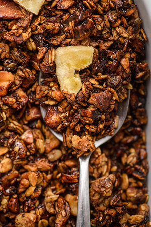 granola baked with nuts and honey with dried banana. high quality photoの写真素材