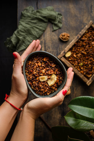 granola on a dark wooden background. high quality photoの写真素材