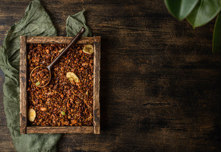 granola on a dark wooden background. high quality photoの写真素材