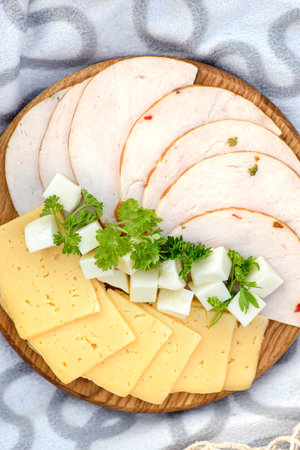 picnic in the field with lupines with cheese and fruit. high quality photoの写真素材