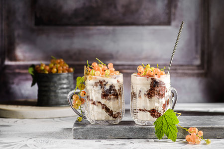 yogurt dessert with currants in a glass. high quality photoの写真素材