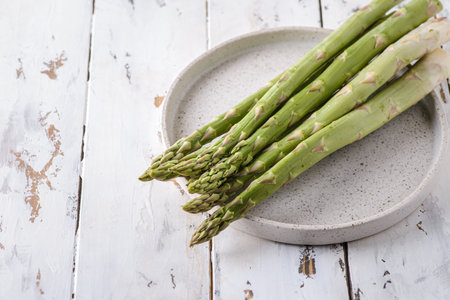 asparagus on a white wooden background. high quality photoの写真素材