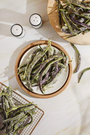 string beans on a beige background. high quality photoの写真素材