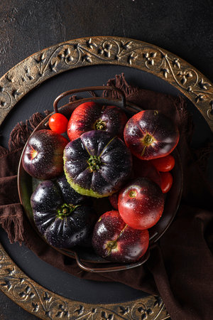assorted organic tomatoes on a metal tray. High quality photoの写真素材