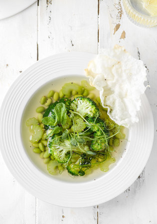 vegetable soup with broccoli and beans on a white wooden background. High quality photoの写真素材