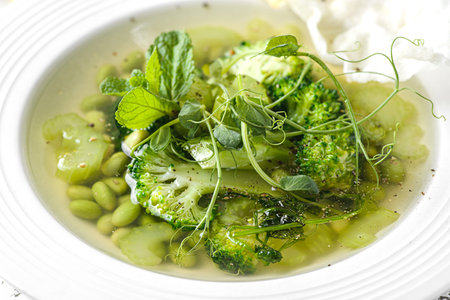 vegetable soup with broccoli and beans on a white wooden background. High quality photoの写真素材
