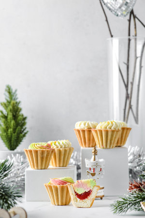 christmas mini cream cakes on a light background in shortbread tartlets. High quality photoの写真素材