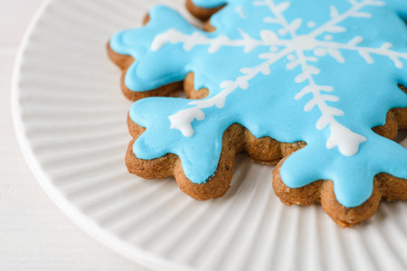 Christmas gingerbread with icing on a white wooden background. High quality photoの写真素材