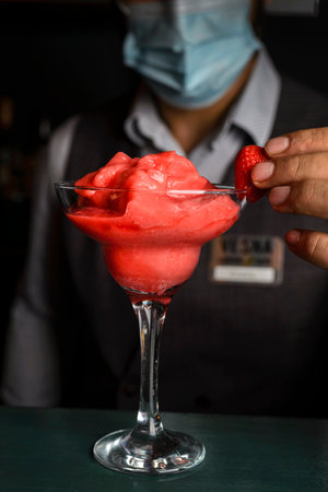 making strawberry smoothies at the bar. High quality photoの写真素材