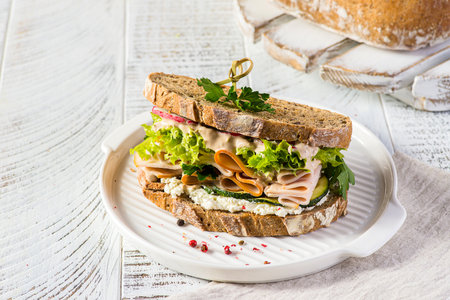 sandwich on dark bread with ham, cucumber and creamcheese. High quality photoの写真素材