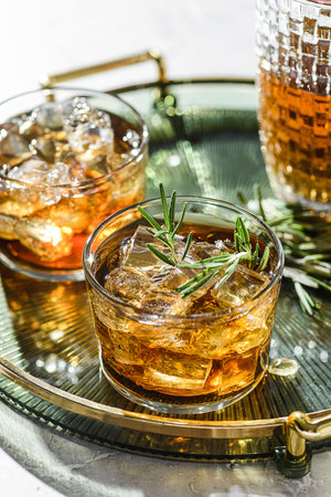 two glasses of whiskey on a tray. High quality photo