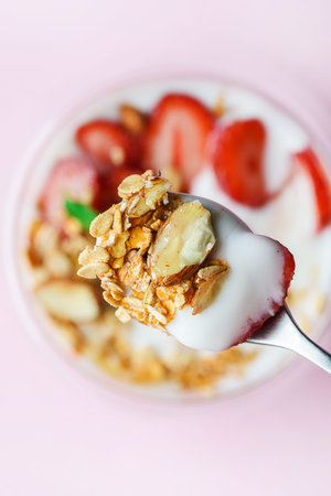 yogurt with strawberries, muesli and honey. High quality photo