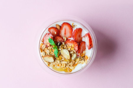 yogurt with strawberries, muesli and honey. High quality photo
