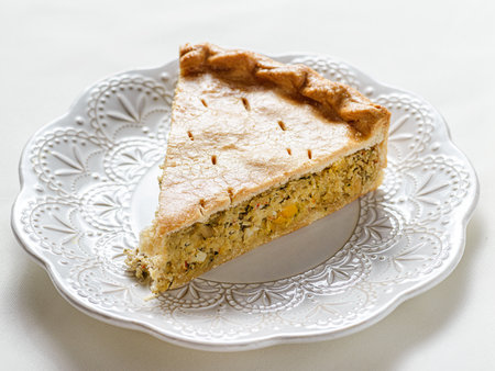 Chicken and egg pie on a light plate. High quality photoの写真素材