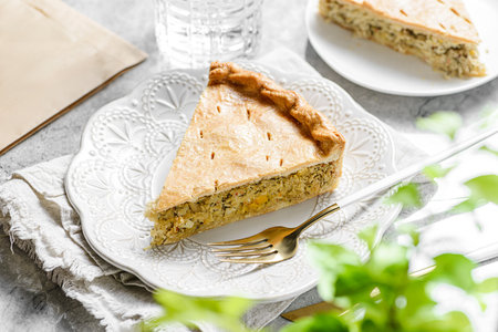 Chicken and egg pie on a light plate. High quality photoの写真素材