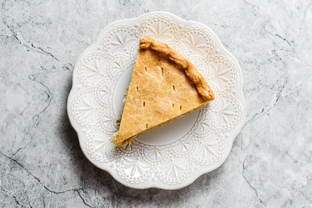 Chicken and egg pie on a light plate. High quality photoの写真素材