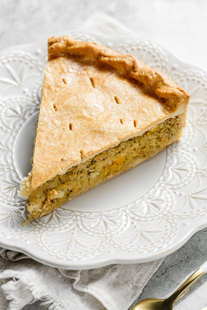Chicken and egg pie on a light plate. High quality photoの写真素材