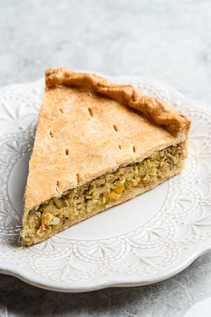 Chicken and egg pie on a light plate. High quality photoの写真素材