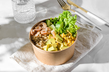 bowl with shrimp, quinoa and corn in a cardboard box. High quality photoの写真素材