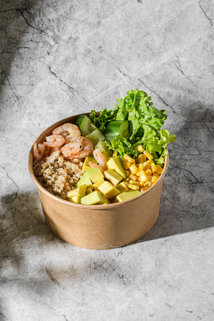 bowl with shrimp, quinoa and corn in a cardboard box. High quality photoの写真素材