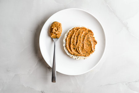 peanut paste with chia on rice bread on a light background. High quality photoの写真素材