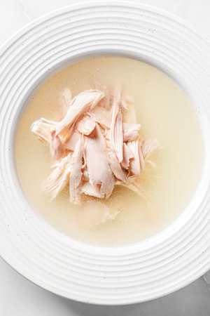chicken broth in a white bowl. High quality photoの写真素材