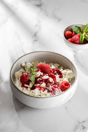 cottage cheese with raspberries and almond petals. High quality photoの写真素材